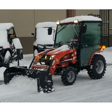 Top Dog Attachments snow pusher on a red compact tractor in the snow