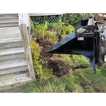 Top Dog Attachments tree spade lifting a shrub by the root ball