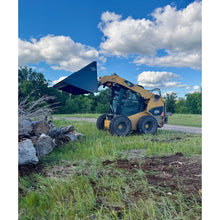 Top Dog Attachments XL firewood bucket raised on a skid steer